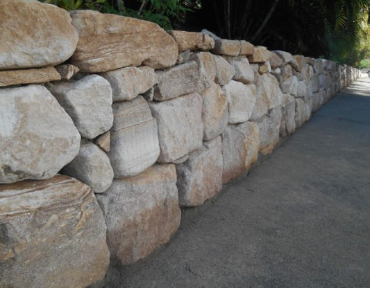 Hand Placed & Dry Stacked Sandstone Rock Wall Installation in Currumbin