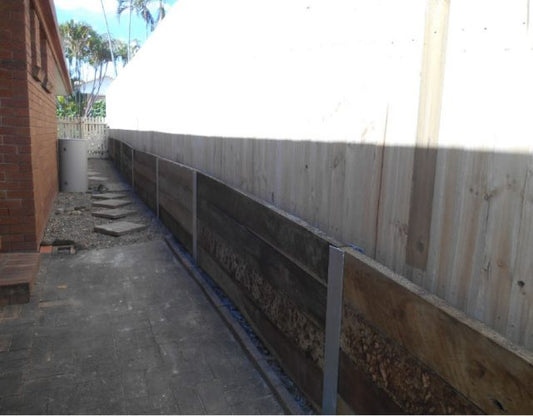 Hardwood Timber Retaining Wall with Steel Posts in Arundel, Gold Coast