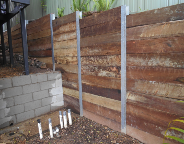 Robust Hardwood Sleeper Wall with H Beam Posts and Platypus Anchor System in Robina