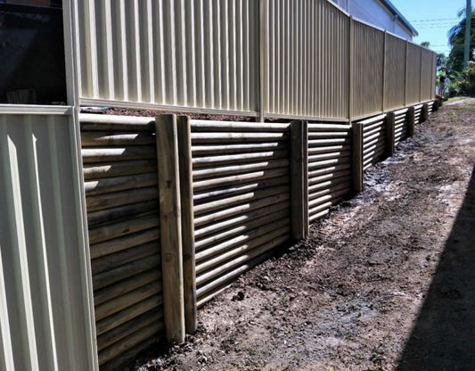 Treated Pine Log Retaining Wall Installation in Southport, Gold Coast