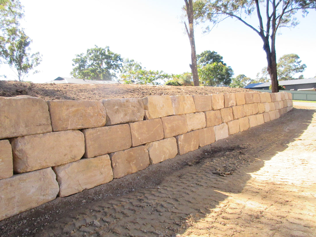 B Grade Sandstone Boulder Retaining Wall in Nerang - Industrial Shed Project