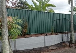 Composite sleeper retaining wall