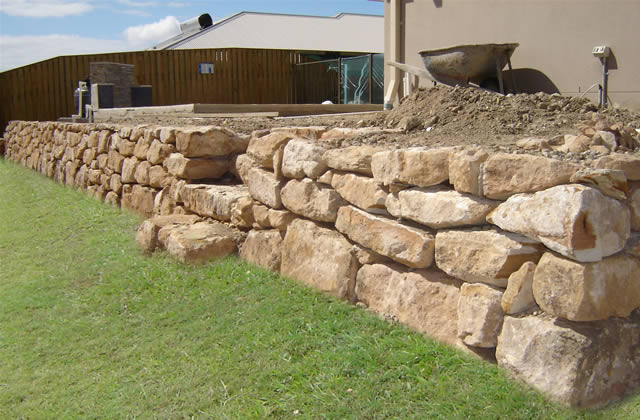 Hand Placed Sandstone Retaining Walls - Elegant and Durable Retaining Solutions